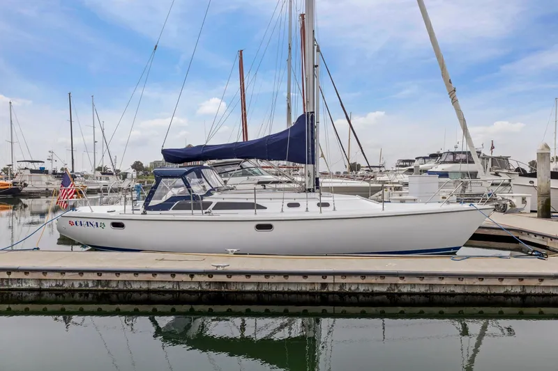 The Image of 2004 Catalina 36 MkII sailboat docked at marina under clear blue sky. - 0