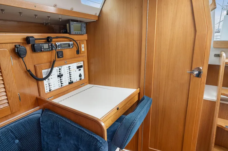 Slide: The Image of Navigation station in a 2004 Catalina 36 MkII sailboat with communication equipment. - 11
