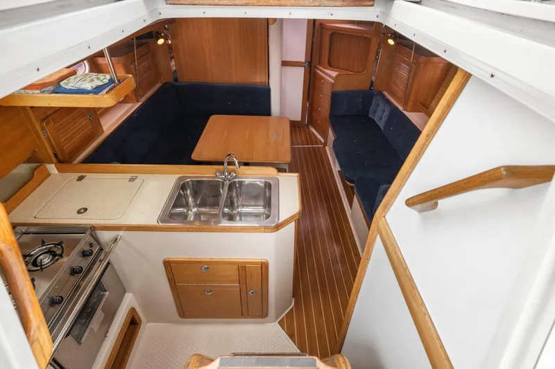 Slide: The Image of Interior of 2004 Catalina 36 MkII sailboat with kitchen and seating area. - 15