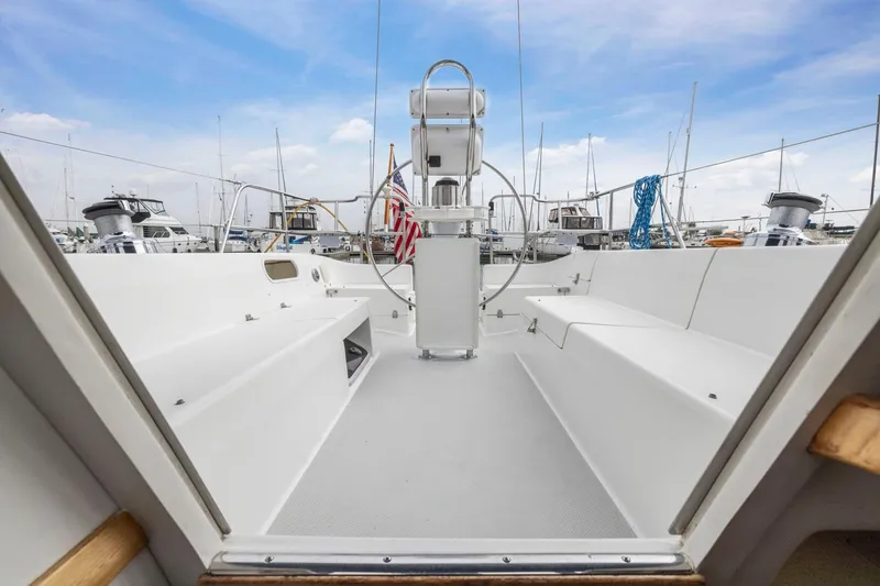 Slide: The Image of Cockpit view of 2004 Catalina 36 MkII sailboat, featuring spacious seating and steering wheel. - 23
