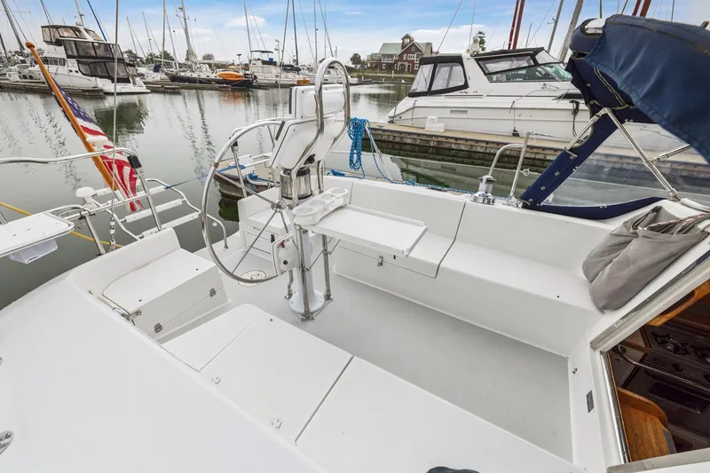 Slide: The Image of Cockpit of 2004 Catalina 36 MkII sailboat docked in marina with other boats. - 29