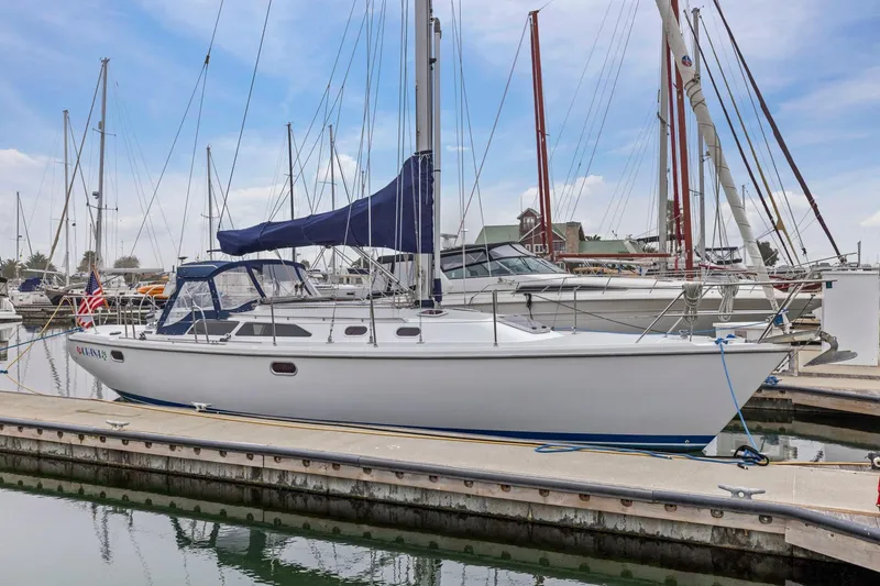 Slide: The Image of 2004 Catalina 36 MkII sailboat docked at marina with blue sky background. - 3