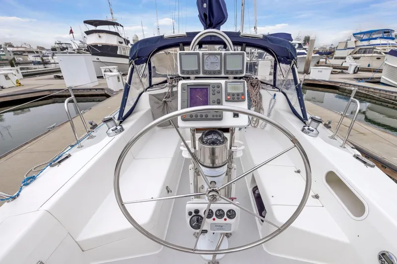 Slide: The Image of Cockpit of 2004 Catalina 36 MkII sailboat with steering wheel and navigation instruments. - 31