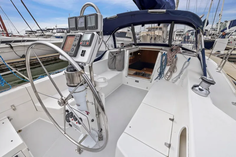 Slide: The Image of 2004 Catalina 36 MkII sailboat cockpit with steering wheel and navigation instruments. - 35