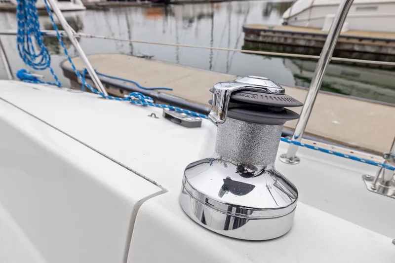 Slide: The Image of Chrome winch on 2004 Catalina 36 MkII sailboat deck, docked at marina. - 36
