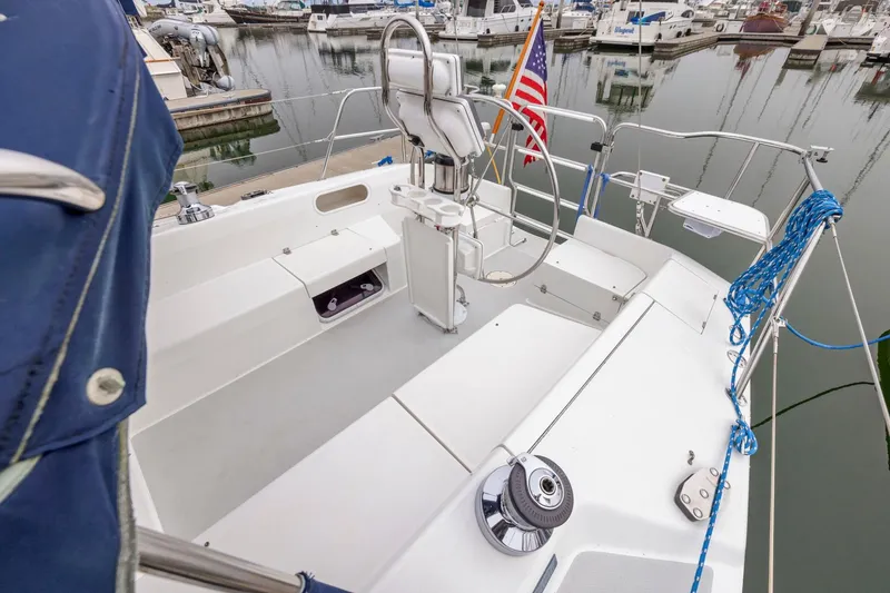 Slide: The Image of 2004 Catalina 36 MkII sailboat cockpit with steering wheel, docked in marina. - 40