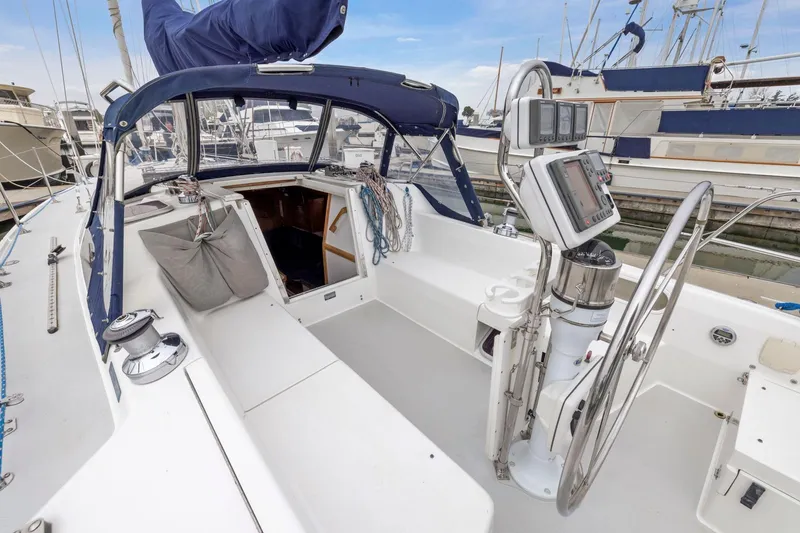 Slide: The Image of 2004 Catalina 36 MkII sailboat cockpit with steering wheel and navigation instruments. - 41