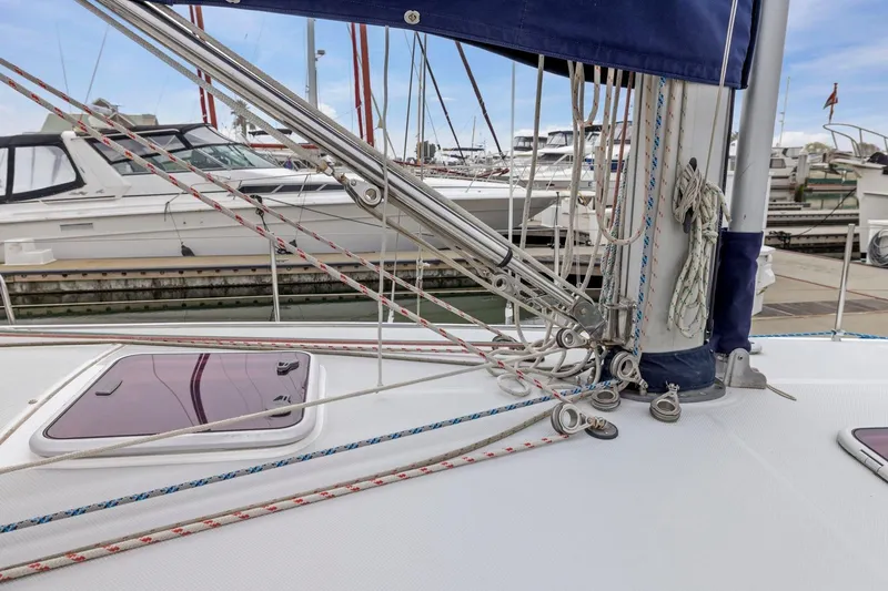 Slide: The Image of 2004 Catalina 36 MkII sailboat deck with rigging and marina background. - 43