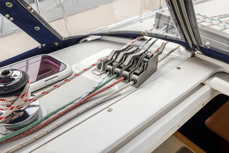 Slide: The Image of Sailing controls on a 2004 Catalina 36 MkII yacht, featuring winches and rope clutches. - 44