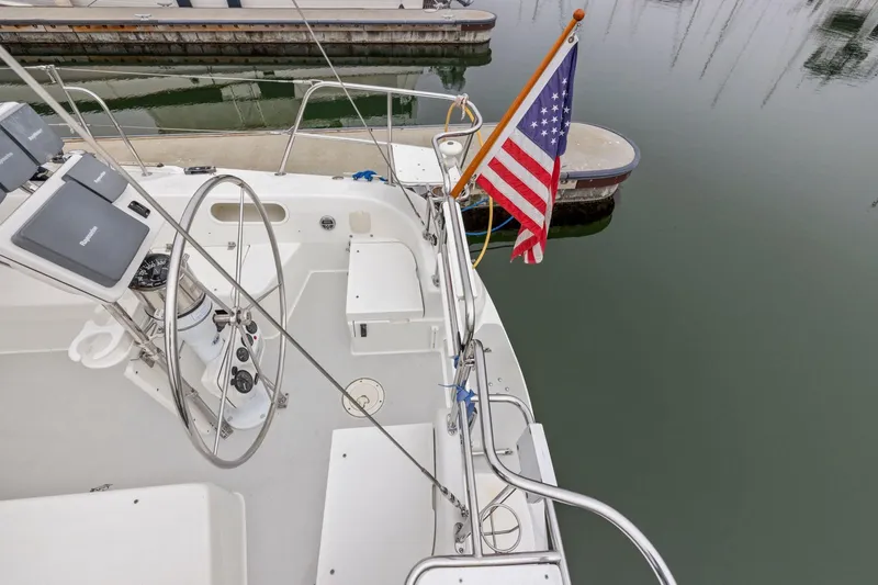 Slide: The Image of Cockpit of 2004 Catalina 36 MkII sailboat with American flag at marina. - 46