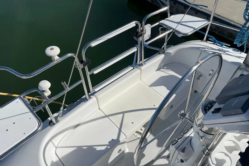 Slide: The Image of Cockpit of 2004 Catalina 36 MkII sailboat with steering wheel and seating area. - 48