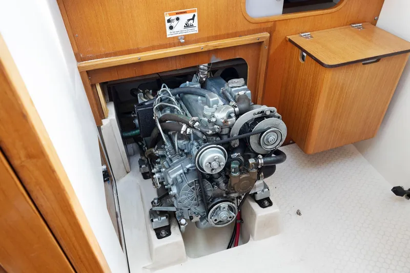 Slide: The Image of Engine compartment of a 2004 Catalina 36 MkII sailboat, showcasing mechanical components. - 50
