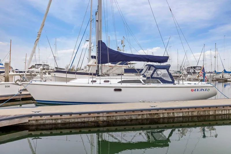 Slide: The Image of 2004 Catalina 36 MkII sailboat docked at marina under clear sky. - 7