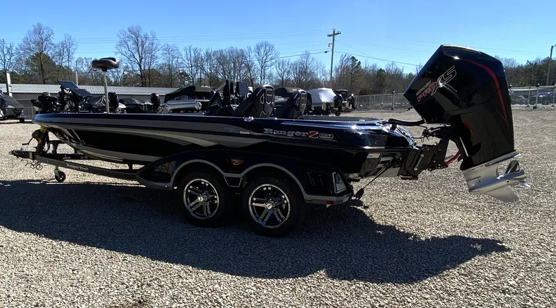 Slide: The Image of 2025 Ranger Z520R boat on gravel lot, side view. - 9