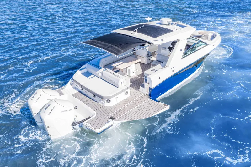 Slide: The Image of 2023 Sea Ray SLX 400 Outboard cruising on open water, showcasing luxury and performance. - 21