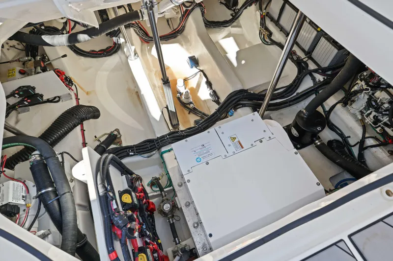 Slide: The Image of Engine compartment of 2023 Sea Ray SLX 400 Outboard, showcasing wiring and components. - 44