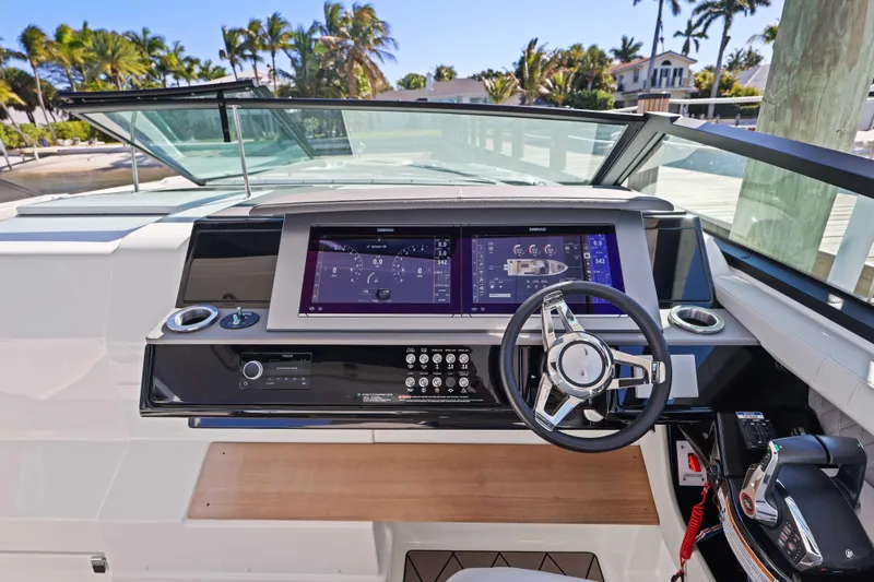 Slide: The Image of 2023 Sea Ray SLX 400 Outboard helm with modern controls and digital displays. - 34