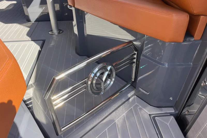 Slide: The Image of 2023 Cruisers Yachts 38 GLS I/O interior with orange seating and sleek metal accents. - 14
