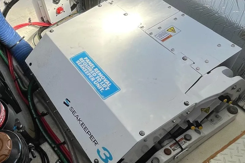 Slide: The Image of 2023 Cruisers Yachts 38 GLS I/O engine room with Seakeeper 3 stabilizer unit. - 19