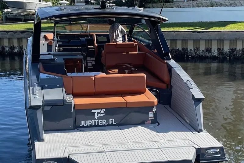 Slide: The Image of 2023 Cruisers Yachts 38 GLS I/O boat docked in Jupiter, FL, with spacious seating. - 3