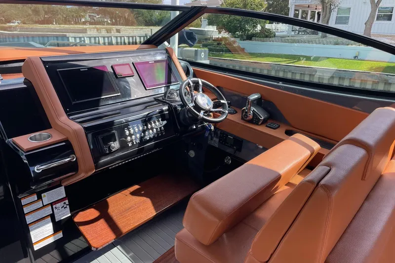 Slide: The Image of 2023 Cruisers Yachts 38 GLS I/O helm with modern controls and luxurious seating. - 41