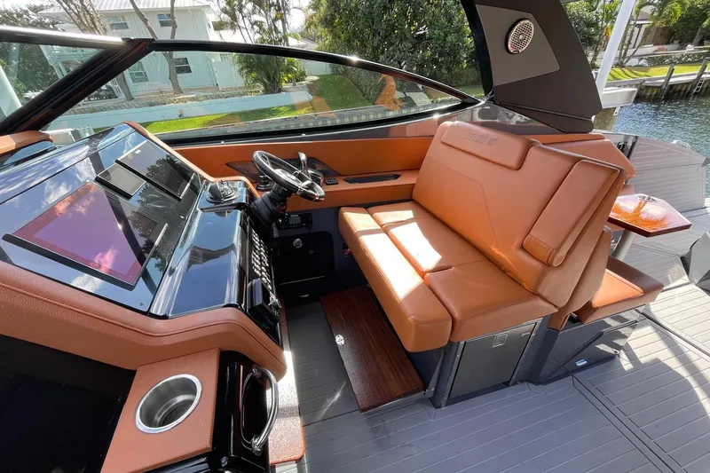 Slide: The Image of 2023 Cruisers Yachts 38 GLS I/O helm with luxurious seating and modern dashboard. - 44