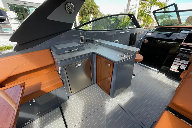Slide: The Image of 2023 Cruisers Yachts 38 GLS I/O interior with sleek kitchenette and modern design. - 46