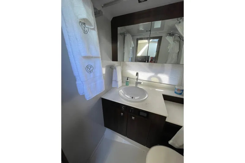 Slide: The Image of Modern bathroom in 2023 Cruisers Yachts 38 GLS I/O with sleek sink and mirror. - 9