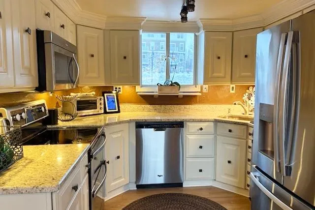 Slide: The Image of Modern kitchen on 1987 Kelly motor yacht with stainless steel appliances and white cabinetry. - 10