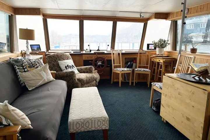 Slide: The Image of Interior of 1987 Kelly motor yacht with cozy seating and panoramic windows. - 12