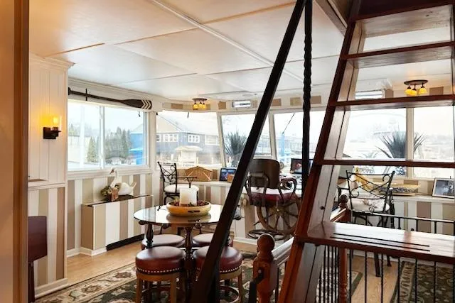 Slide: The Image of Interior of a 1987 Kelly motor yacht with elegant decor and large windows. - 14