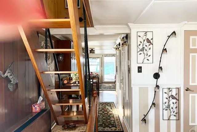 Slide: The Image of Interior of a 1987 Kelly motor yacht with wooden stairs and decorative wall art. - 15