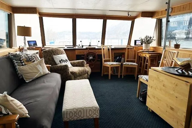 Slide: The Image of Interior of a 1987 Kelly motor yacht with cozy seating and nautical decor. - 18