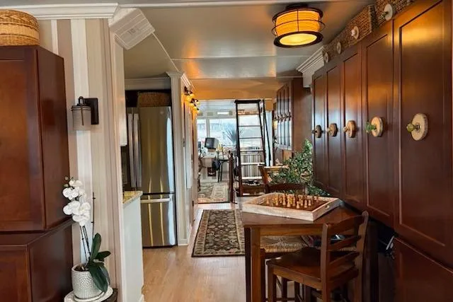 Slide: The Image of Luxurious interior of a 1987 Kelly motor yacht featuring elegant wood paneling and a chess table. - 19