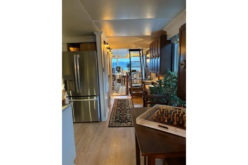 Slide: The Image of Interior of a 1987 Kelly motor yacht with modern kitchen and chessboard. - 22
