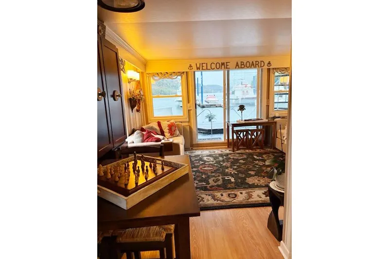 Slide: The Image of Cozy interior of 1987 Kelly motor yacht with chess set and "Welcome Aboard" sign. - 25