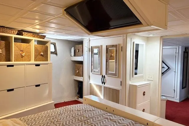 Slide: The Image of Luxurious interior of 1987 Kelly motor yacht with modern storage and cozy decor. - 26