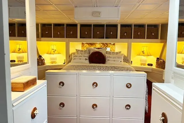 Slide: The Image of Cozy bedroom on 1987 Kelly motor yacht with warm lighting and nautical decor. - 27