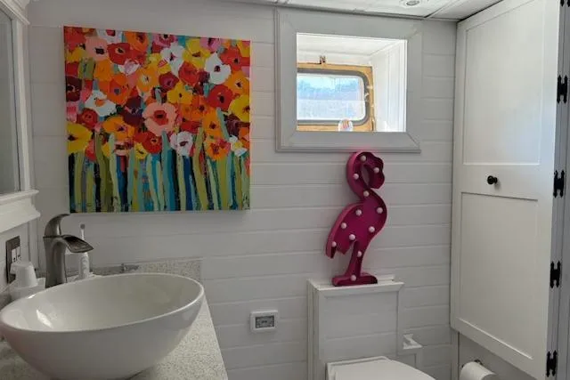 Slide: The Image of Bathroom on 1987 Kelly motor yacht with colorful decor and modern fixtures. - 32