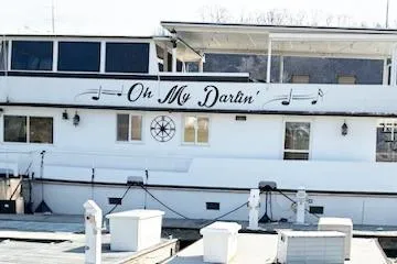 Slide: The Image of 1987 Kelly motor yacht "Oh My Darlin'" docked at a marina. - 4