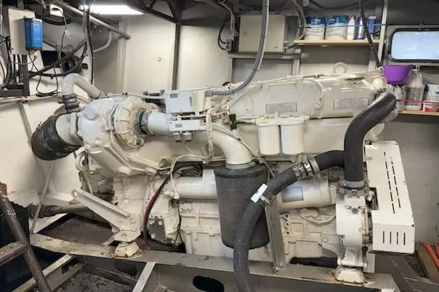 Slide: The Image of Engine room of 1987 Kelly motor yacht with visible machinery and components. - 45