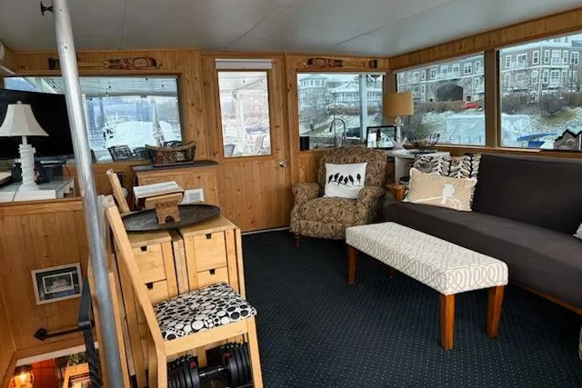 Slide: The Image of Interior of 1987 Kelly motor yacht with cozy seating and wooden paneling. - 47