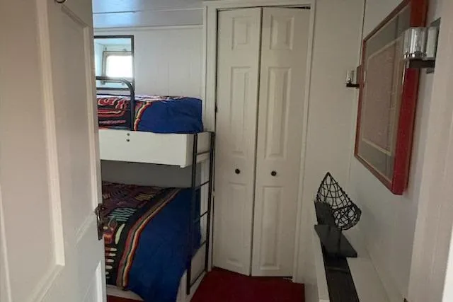 Slide: The Image of Interior of 1987 Kelly motor yacht with bunk beds and modern decor. - 49