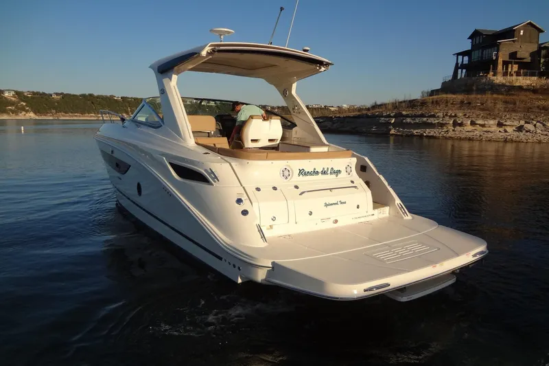 The Image of 2017 Sea Ray Sundancer 350 cruising on a serene lake at sunset. - 0