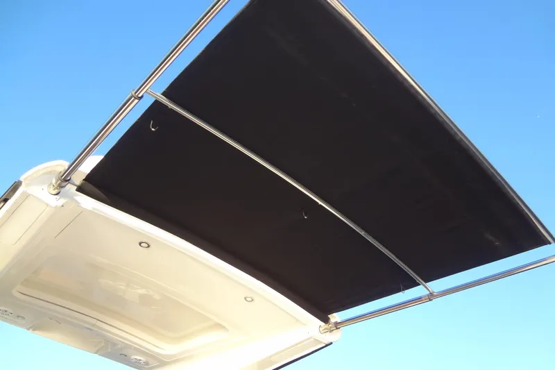 Slide: The Image of 2017 Sea Ray Sundancer 350 boat canopy against clear blue sky. - 19