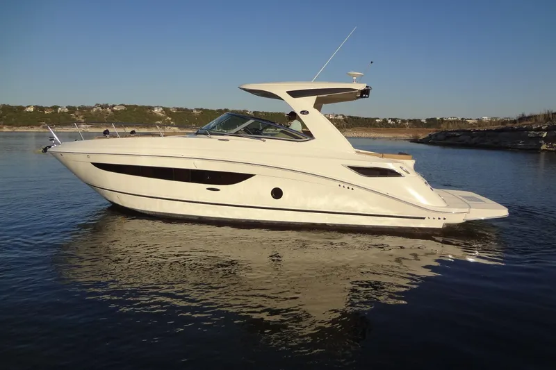 Slide: The Image of 2017 Sea Ray Sundancer 350 yacht on calm water, side view. - 2