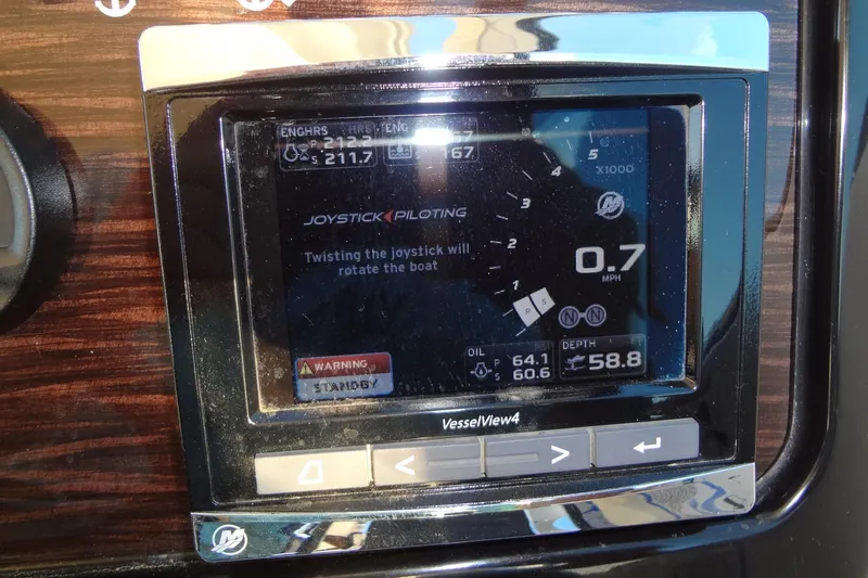 Slide: The Image of 2017 Sea Ray Sundancer 350 dashboard display with joystick piloting controls. - 28