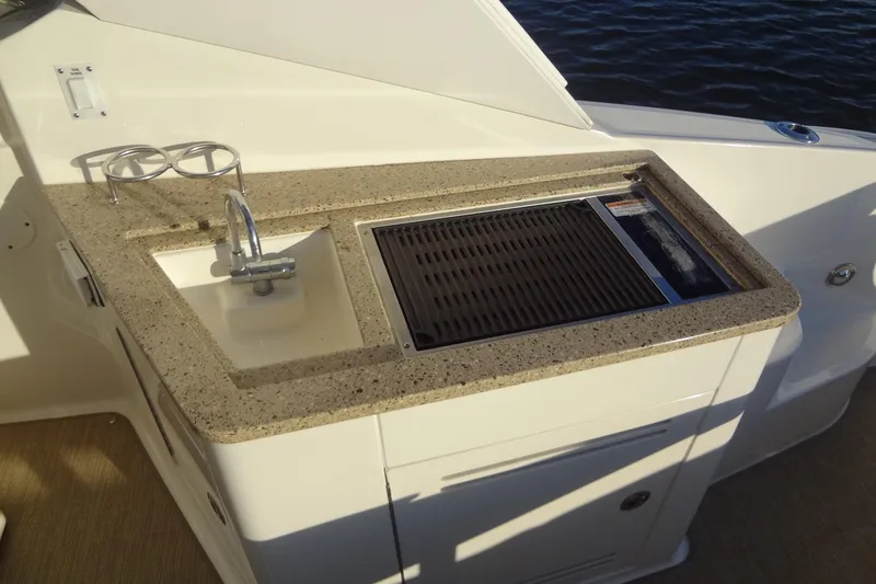 Slide: The Image of Outdoor kitchenette on 2017 Sea Ray Sundancer 350 yacht with sink and grill. - 31