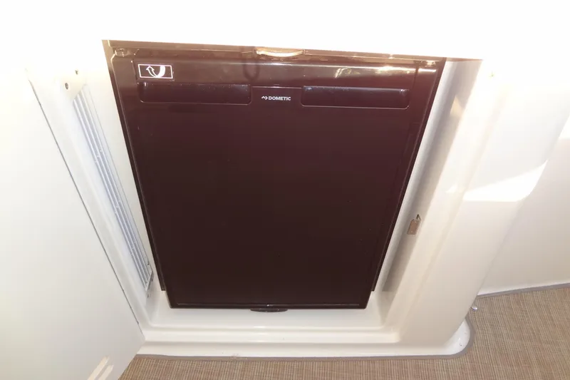 Slide: The Image of Compact refrigerator in 2017 Sea Ray Sundancer 350 yacht interior. - 32