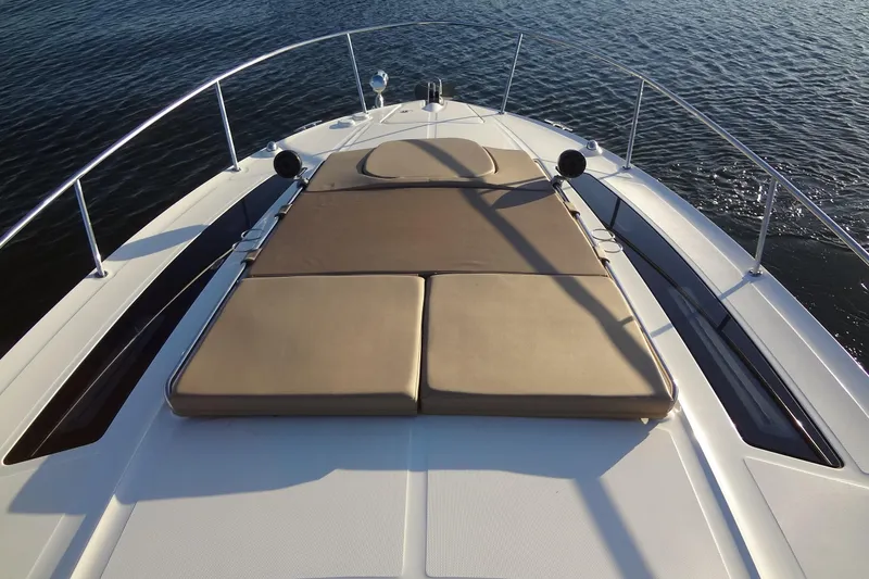 Slide: The Image of 2017 Sea Ray Sundancer 350 boat with sunpad on deck, cruising on calm water. - 34